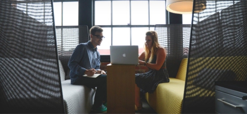 Co-workers meeting in a huddle space