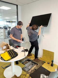AV technicians fitting large display screen at BCS Swindon AV technicians fitting large display screen at BCS Swindon.