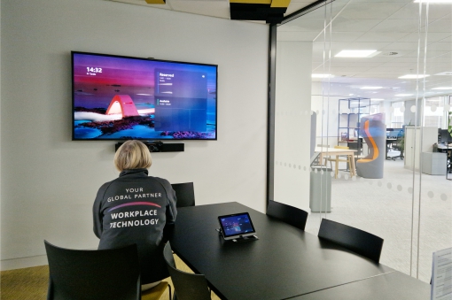 Sitting in one of the meeting rooms in BCS Swindon offices checking the audiovisual equipment.