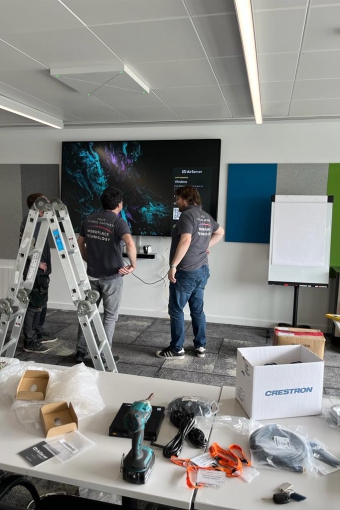Gallery 30 Installing screens in one of Bristol airport training rooms