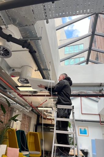 Gallery 35 Installing ceiling microphones in multipurpose meeting space..