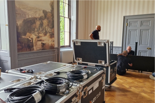 Gallery 43 Unpacking a large video wall in the ball room at Hartham Park.