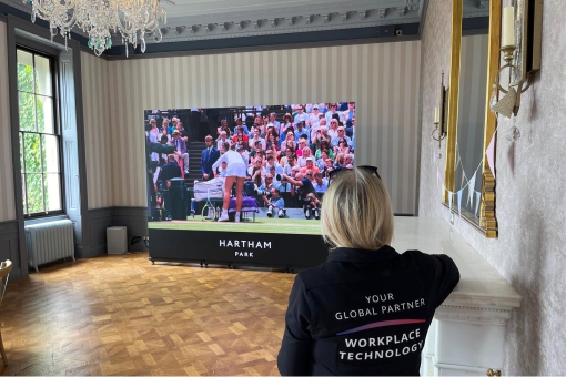 Gallery 45 Sussi viewing the large LED video wall installation at Hartham Park.