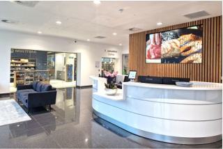 1 Multivac reception Bright reception area at Multivac with large display screen.