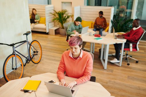 woman working on a laptop in a coworking space