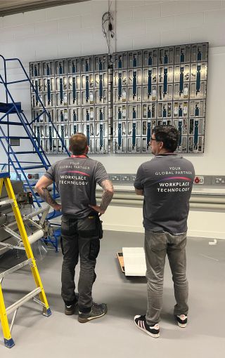 team setting up a large LED display Team setting up a large al-in-one LG LED screen.